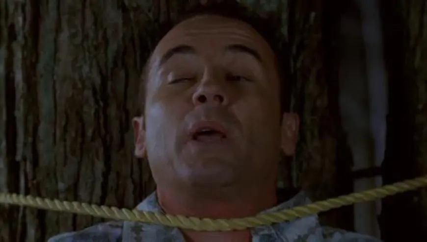 man strapped to a tree with rope around his neck: Sleepaway Camp (1983)