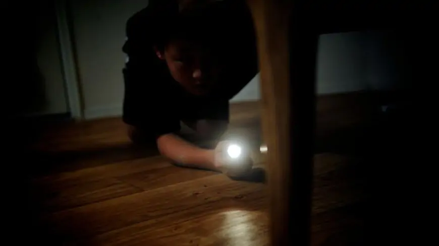 boy playing Flashlight Tag