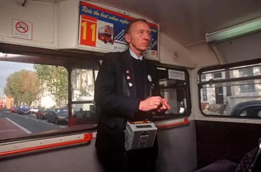 Bus conductor on a UK bus in the 1980s